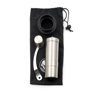 metallic silver hand coffee grinder with black bag holder