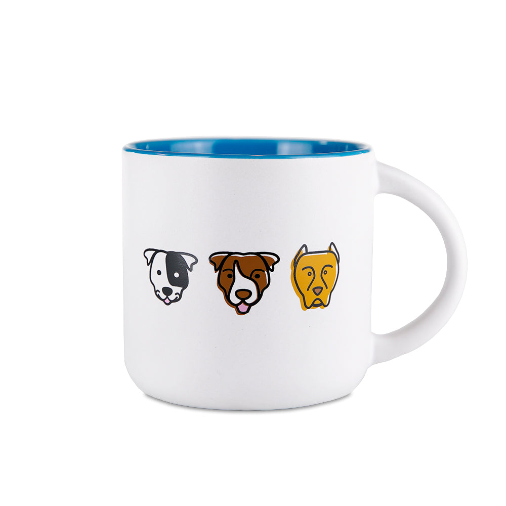 white mug with blue interior and three pit bull dog head design