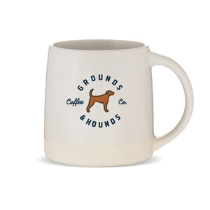 beige mug with grounds and hounds logo plus brown dog